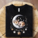 Shirt of a baby boy deer sleeping adorably on a crescent moon with stars all around.